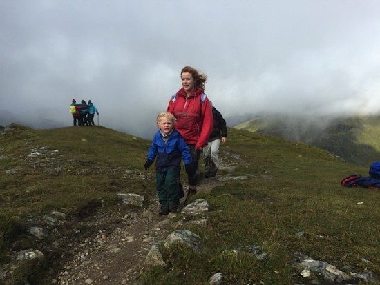 Tansy's children India and Archie walk towards the Munro top.